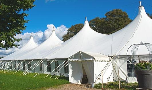 a line of sleek and modern portable restrooms ready for use at an upscale corporate event in Leonardo